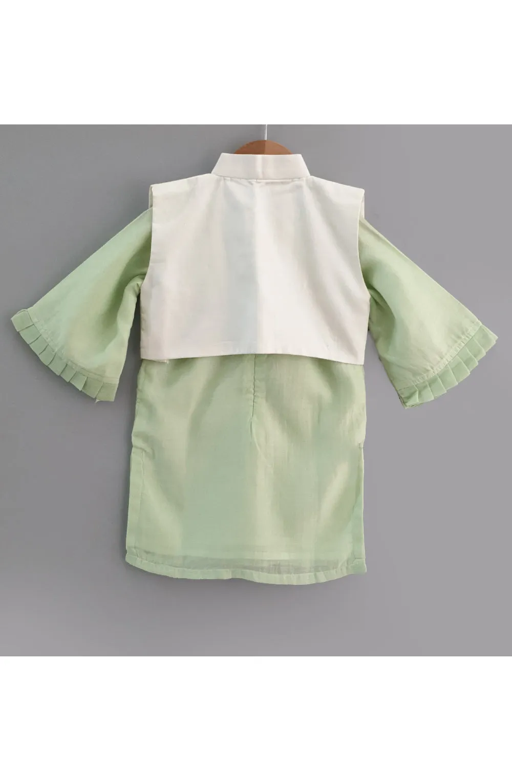 Light green kurta and straight pyjama with embroidered jacket